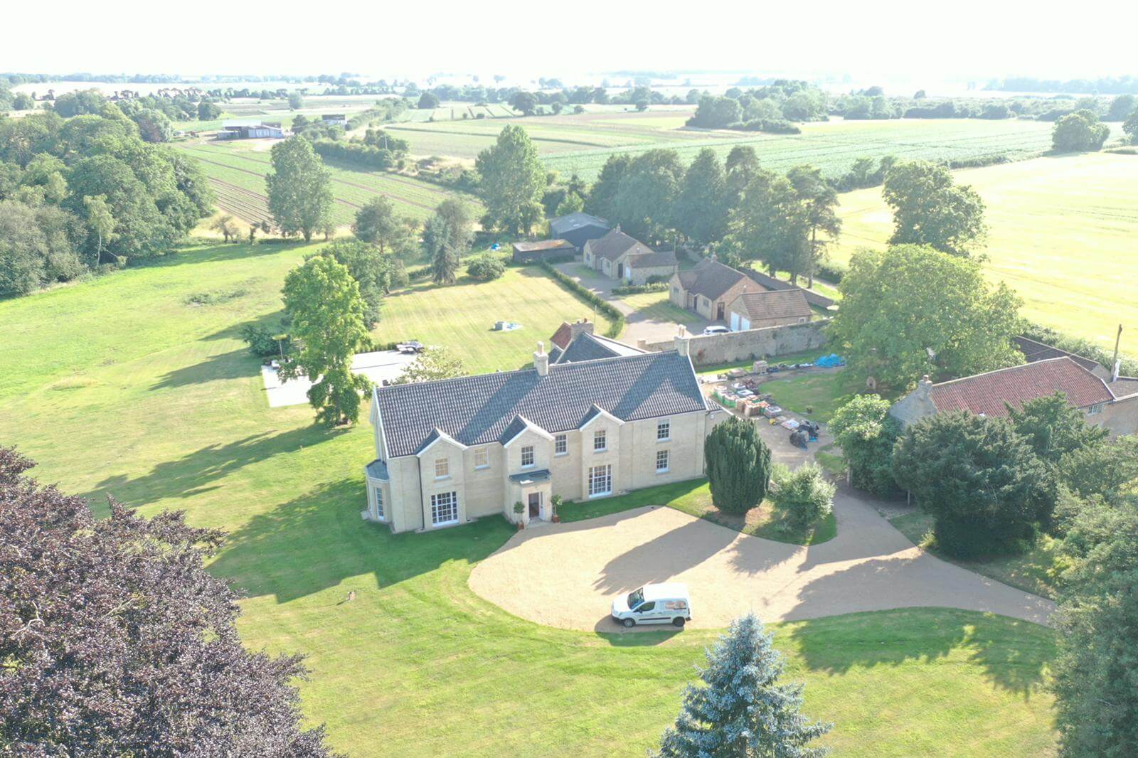 drone photo of the old rectory, showing the main building, lodge, cottage and coach house